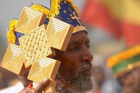 Addis Ababa, Prist with a processional cross, Timket Festiva